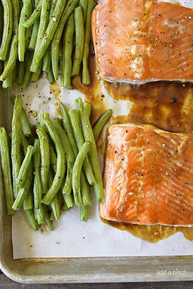 Sheet Pan Teriyaki Salmon with Green Beans Recipe - This Sheet Pan Teriyaki Salmon with Green Beans recipe comes together in a snap! Ready and on the table in less than 30 minutes, it is a definite family favorite meal! // addapinch.com