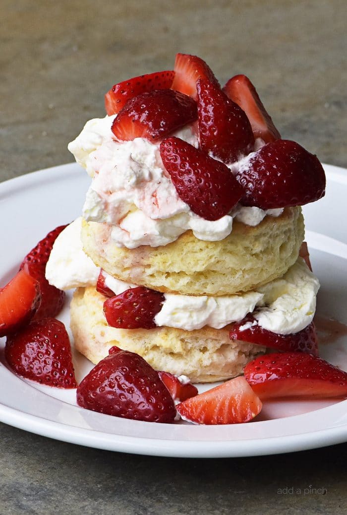 Strawberry Shortcake Recipe - Strawberry Shortcakes with Sweet Cream Cheese Biscuits make a simple, yet scrumptious dessert recipe perfect for spring and summer! // addapinch.com