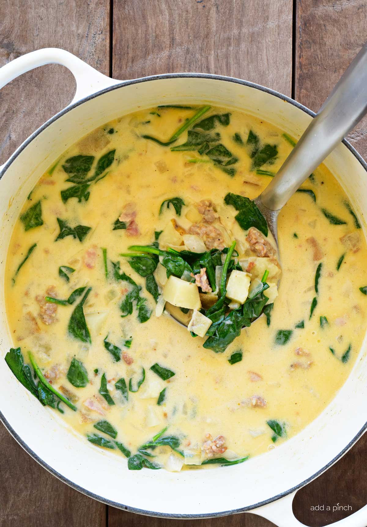Easy homemade zuppa toscano in a white Dutch oven.
