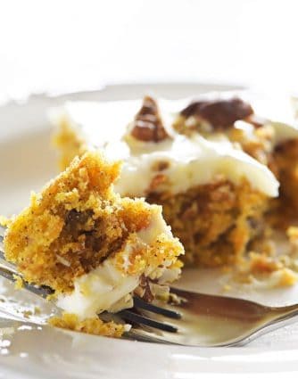 Easy Carrot Cake Sheet Cake Recipe - This Easy Carrot Cake Sheet Cake recipe comes together easily and bakes into a beautiful, delicious carrot cake! Topped with a fluffy cream cheese frosting, this carrot cake is one everyone asks for the recipe! // addapinch.com