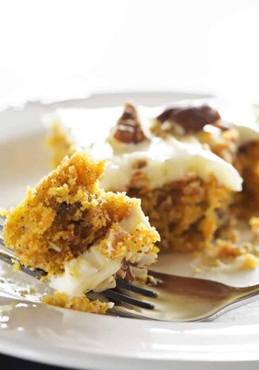 Easy Carrot Cake Sheet Cake Recipe - This Easy Carrot Cake Sheet Cake recipe comes together easily and bakes into a beautiful, delicious carrot cake! Topped with a fluffy cream cheese frosting, this carrot cake is one everyone asks for the recipe! // addapinch.com