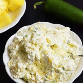 Pineapple Jalapeno Cream Cheese Spread - This quick and easy recipe comes together in a snap with just four ingredients! This sweet and spicy cream cheese spread is perfect for sandwiches, wraps, crackers or bagels! // addapinch.com
