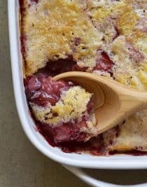 Strawberry Cobbler Recipe - This Strawberry Cobbler Recipe is a classic Southern dessert! This easy strawberry cobbler recipe comes together quickly and bakes into a thick, sweet, yet still tart, strawberry layer topped with a cake like topping. // addapinch.com