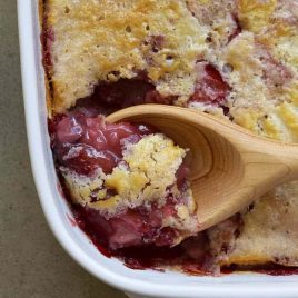 Strawberry Cobbler Recipe - This Strawberry Cobbler Recipe is a classic Southern dessert! This easy strawberry cobbler recipe comes together quickly and bakes into a thick, sweet, yet still tart, strawberry layer topped with a cake like topping. // addapinch.com