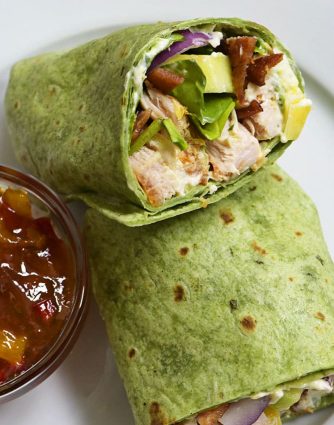 Sweet and Spicy Chicken Wraps - Quick, easy and oh so delicious! This chicken wraps recipe is made with chicken, bacon, cucumbers, red onions, and a special sweet and spicy spread! // addapinch.com