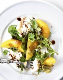Peach, Basil and Burrata Salad Recipe - A delicious take on a traditional caprese salad, this peach, basil and burrata salad comes together in minutes and is just as delicious as it is beautiful. // addapinch.com