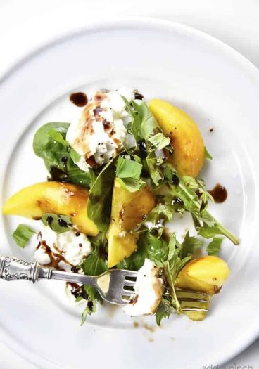 Peach, Basil and Burrata Salad Recipe - A delicious take on a traditional caprese salad, this peach, basil and burrata salad comes together in minutes and is just as delicious as it is beautiful. // addapinch.com