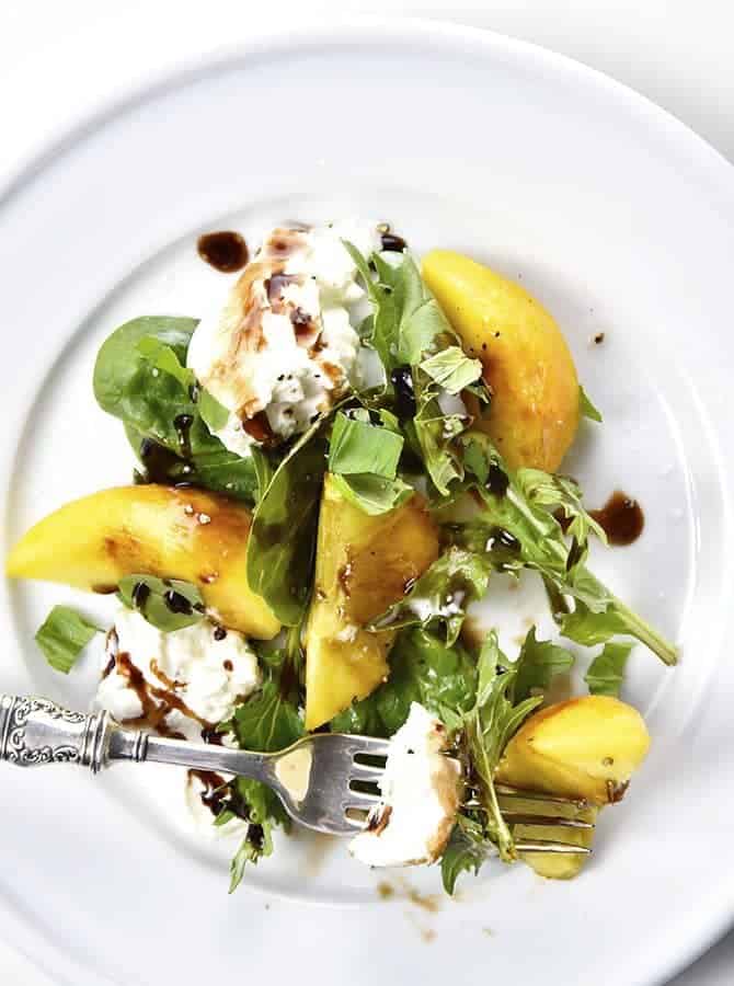 Peach, Basil and Burrata Salad Recipe - A delicious take on a traditional caprese salad, this peach, basil and burrata salad comes together in minutes and is just as delicious as it is beautiful. // addapinch.com