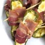 Pineapple Jalapeno Popper Recipe - Sweet and spicy, these jalapeno poppers are made with a pineapple cream cheese spread, wrapped with bacon and baked to perfection! // addapinch.com