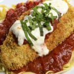 Baked Chicken Parmesan Recipe - This baked chicken parmesan recipe includes everything you love about chicken parmesan without all the guilt or mess! // addapinch.com