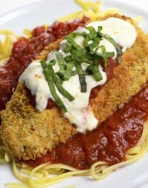 Baked Chicken Parmesan Recipe - This baked chicken parmesan recipe includes everything you love about chicken parmesan without all the guilt or mess! // addapinch.com