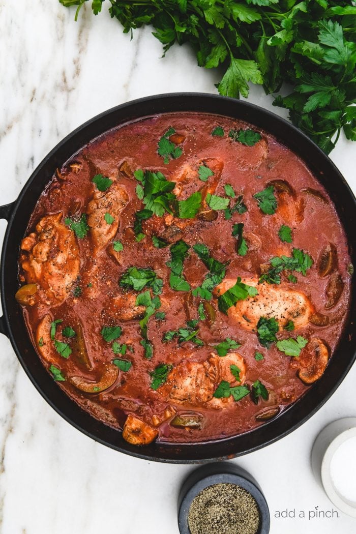 The Best Chicken Cacciatore made in a rich tomato and the most tender chicken is classic Italian comfort food at its best! // addapinch.com