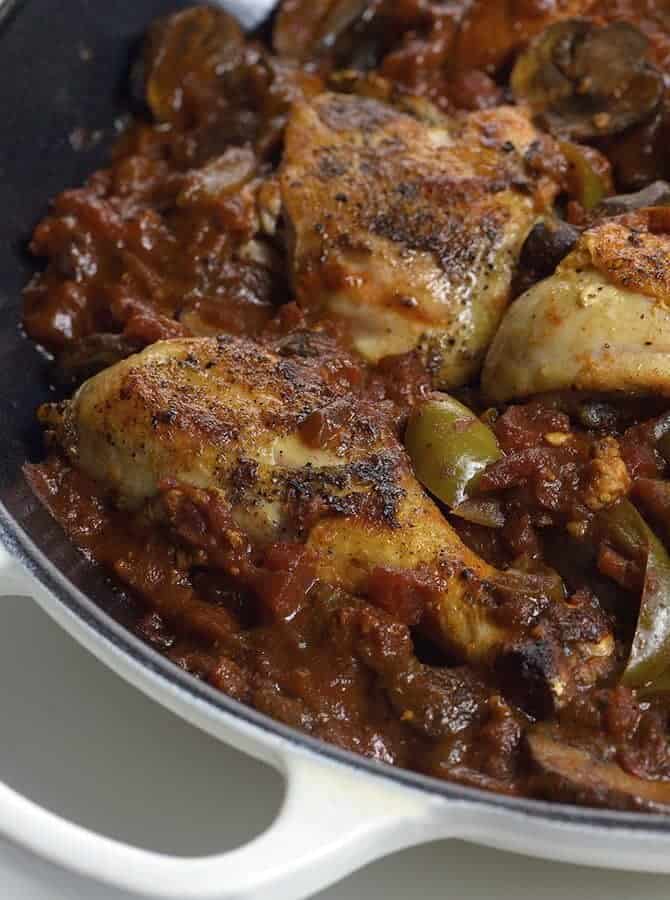 Chicken Cacciatore Recipe - Chicken Cacciatore made in a flavorful tomato sauce and tender chicken is a simple, yet comforting Italian classic at its best. // addapinch.com