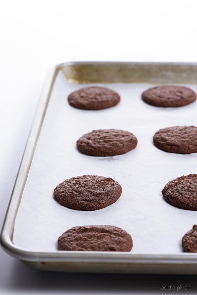 Chocolate Sugar Cookies Recipe - This easy recipe makes the best soft chocolate sugar cookies! A crisp outside with a tender, chewy center makes these cookies and absolute favorite! // addapinch.com