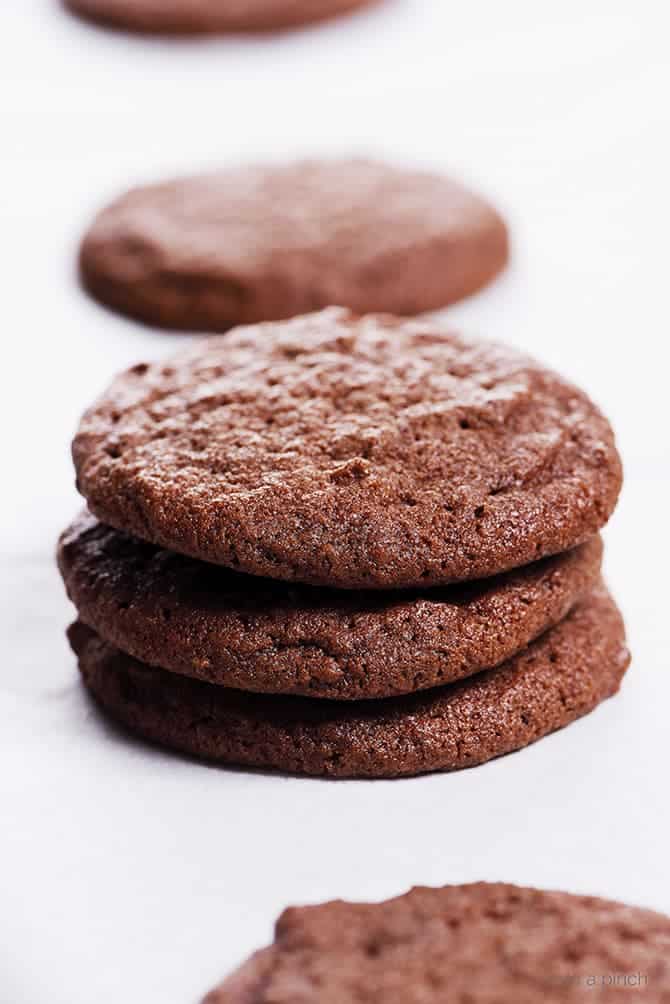 Chocolate Sugar Cookies Recipe - This easy recipe makes the best soft chocolate sugar cookies! A crisp outside with a tender, chewy center makes these cookies and absolute favorite! // addapinch.com