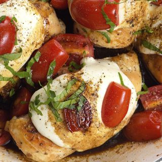 Skillet Caprese Chicken Recipe - This quick and easy chicken recipe is perfect for busy weeknights and delicious enough for entertaining! // addapinch.com