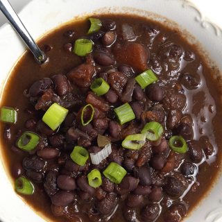 Black Bean Soup Recipe - This delicious black bean soup is packed with flavor and made even easier with the slow cooker! // addapinch.com