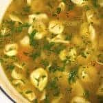 Tortellini Soup is perfect for busy nights! Made with vegetables, cheesy tortellini and topped with fresh parmesan! Ready and on the table in 30 minutes! // addapinch.com