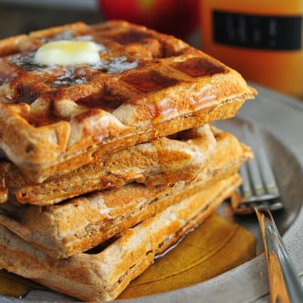 photograph of waffles on a metal plate.