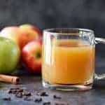 Homemade Apple Cider Recipe - Easy and delicious homemade apple cider recipe made with apples, oranges, cinnamon, and cloves. Stovetop and slow cooker instructions included! // addapinch.com