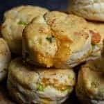 Cheddar Scallion Biscuits Recipe - Tender and delicious, these fluffy, cheesy cheddar scallion biscuits make the perfect addition to any meal and couldn't be easier! // addapinch.com