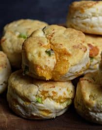 Cheddar Scallion Biscuits Recipe - Tender and delicious, these fluffy, cheesy cheddar scallion biscuits make the perfect addition to any meal and couldn't be easier! // addapinch.com