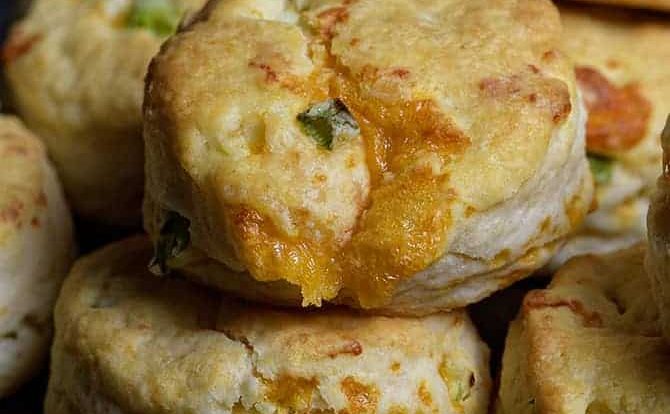 Cheddar Scallion Biscuits Recipe - Tender and delicious, these fluffy, cheesy cheddar scallion biscuits make the perfect addition to any meal and couldn't be easier! // addapinch.com