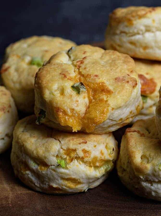 Cheddar Scallion Biscuits Recipe - Tender and delicious, these fluffy, cheesy cheddar scallion biscuits make the perfect addition to any meal and couldn't be easier! // addapinch.com