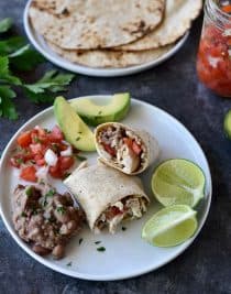 Shredded Chicken Burritos Recipe - This traditional chicken burrito makes a quick and easy meal comes together in a snap for a favorite lunch or supper! // addapinch.com