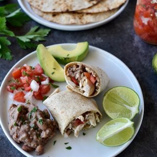 Shredded Chicken Burritos Recipe - This traditional chicken burrito makes a quick and easy meal comes together in a snap for a favorite lunch or supper! // addapinch.com
