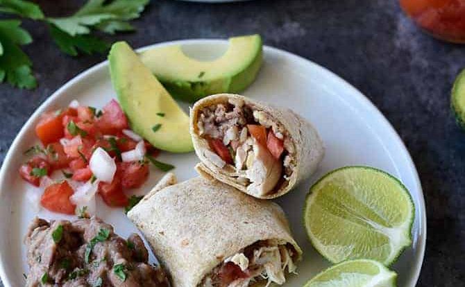 Shredded Chicken Burritos Recipe - This traditional chicken burrito makes a quick and easy meal comes together in a snap for a favorite lunch or supper! // addapinch.com
