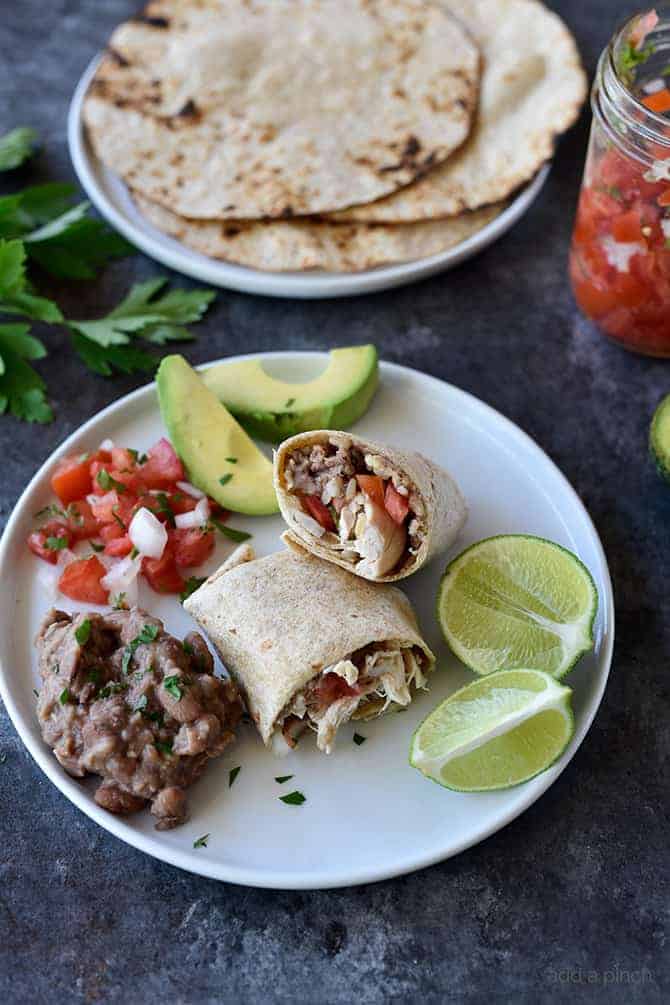 Shredded Chicken Burritos Recipe - This traditional chicken burrito makes a quick and easy meal comes together in a snap for a favorite lunch or supper! // addapinch.com