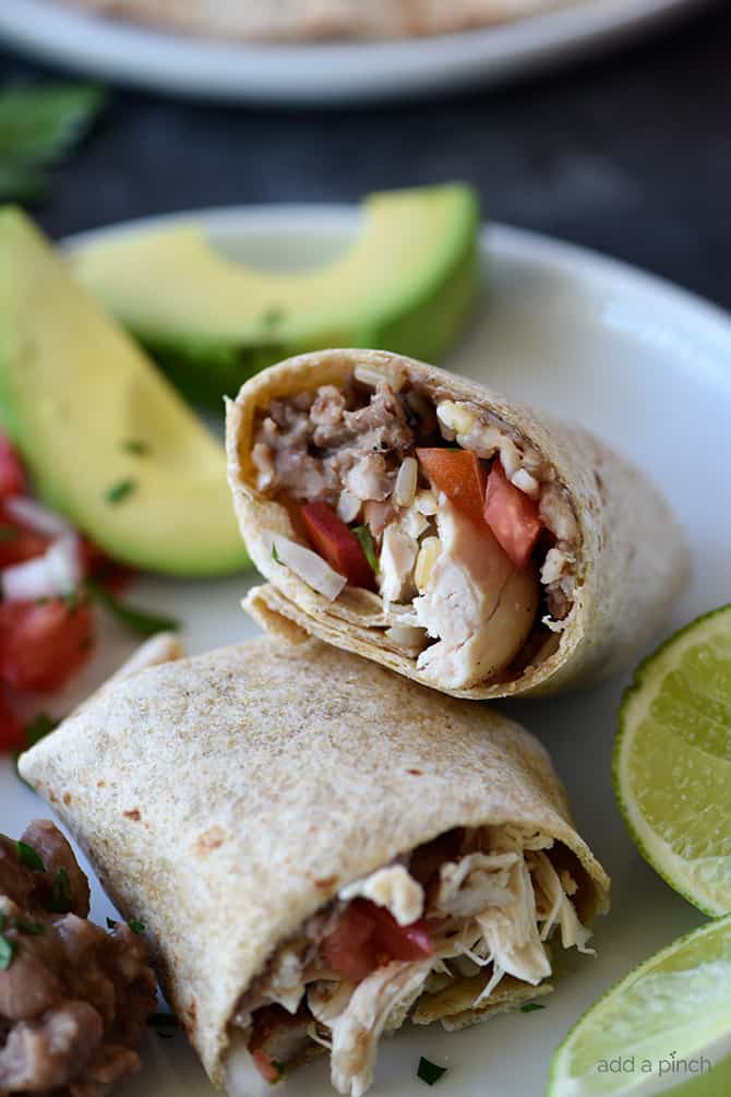 Shredded Chicken Burritos Recipe - This traditional chicken burrito makes a quick and easy meal comes together in a snap for a favorite lunch or supper! // addapinch.com