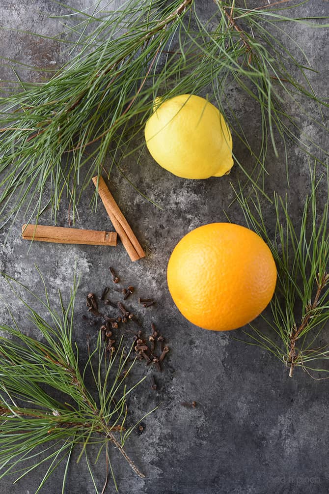 Pine Citrus Potpourri - This all natural, quick and easy potpourri recipe makes your home smell amazing with fresh fruits, spices, and a touch of pine! // addapinch.com