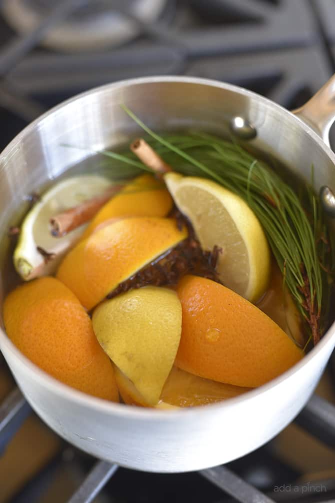 How to Make Potpourri - This all natural, quick and easy potpourri recipe makes your home smell amazing with fresh fruits, spices, and a touch of nature! // addapinch.com