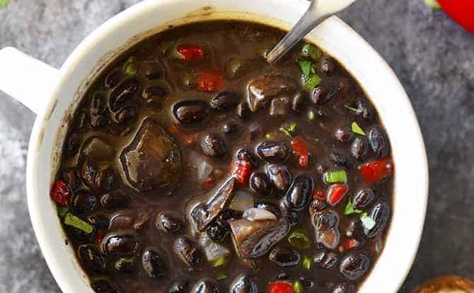 Red Pepper Mushroom Black Bean Soup Recipe - This quick and easy black bean soup recipe comes together in a snap for a vegetarian soup recipe that even meat lovers with adore! // addapinch.com