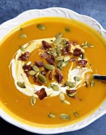 Creamy Pumpkin Soup Recipe - This classic pumpkin soup recipe is creamy, dreamy and made without cream! Quick and easy, this pumpkin soup comes together in a snap for simple weeknight or when entertaining through the holidays! // addapinch.com