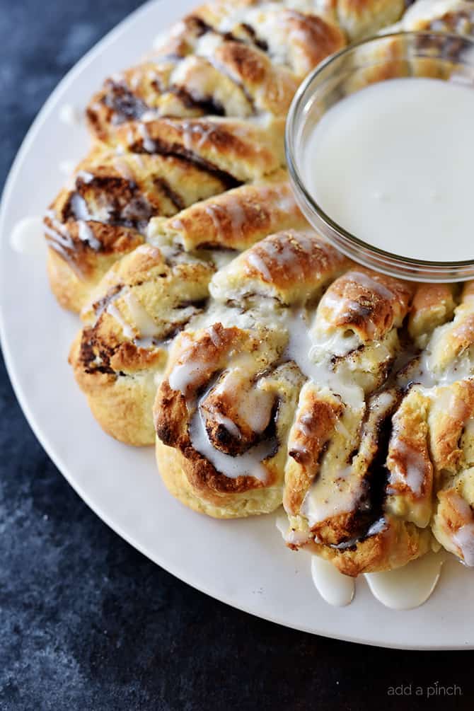 Side view of Cinnamon Roll Wreath with icing drizzled 