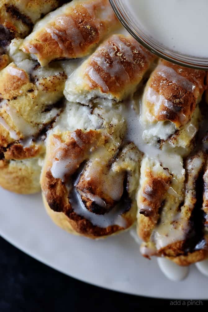 Closeup of Cinnamon Roll Biscuit Wreath drizzled with icing 