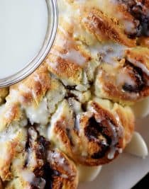 Cinnamon Roll Biscuit Wreath Recipe - Quick and easy this treat has everything you love about a cinnamon roll with the ease of a biscuit in the shape of a festive wreath! // addapinch.com