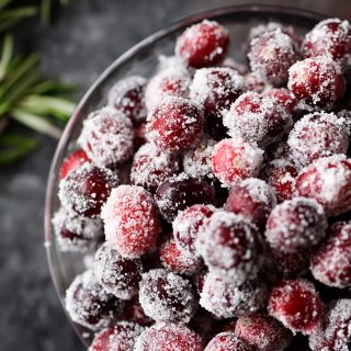 Sugared Cranberries Recipe - These sparkly sugared cranberries come together quickly and easily with just two simple ingredients! Beautiful as garnish for cakes, cookies, cocktails, or to serve as a sweet, yet tart treat! // addapinch.com