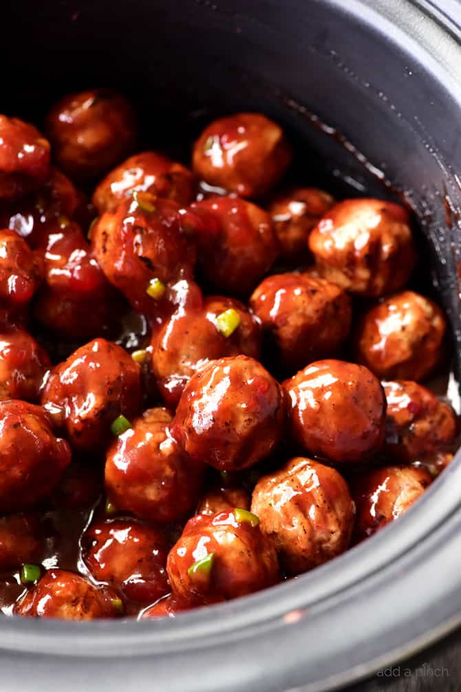 Sweet and Spicy Cranberry Cocktail Meatballs Recipe - An update on a classic party favorite, these sweet and spicy cranberry cocktail meatballs are always a hit! // addapinch.com
