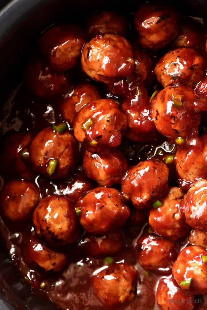 Sweet and Spicy Cranberry Cocktail Meatballs Recipe - An update on a classic party favorite, these sweet and spicy cranberry cocktail meatballs are always a hit! // addapinch.com