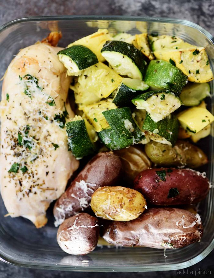 Sheet Pan Parmesan Chicken and Vegetables Recipe - This super easy, 30 minute meal makes a simple, yet scrumptious supper of juicy chicken and vegetables topped with Parmesan! // addapinch.com