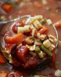 Slow Cooker Minestrone Soup Recipe - Loaded with seasonal vegetables, this minestrone soup is made even easier in this slow cooker recipe! A definite family favorite! // addapinch.com