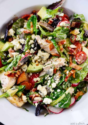 Rosemary Chicken Salad Recipe with Rosemary Ranch Dressing - Tender baked rosemary chicken is the star in this loaded salad recipe topped with a flavorful rosemary ranch dressing. The perfect combination of crunch, creamy, salty and so, so good! // addapinch.com