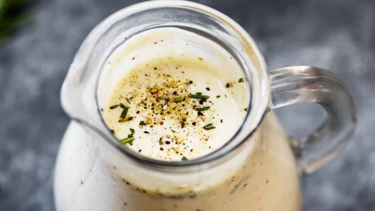 Rosemary Ranch Dressing Recipe - This simple ranch dressing is an update to the classic ranch dressing with fresh rosemary and spices and adds so much flavor to salads, chicken, and so many dishes! // addapinch.com
