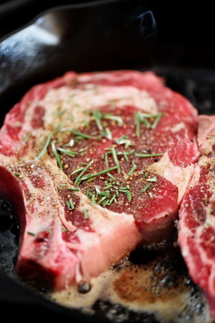 Skillet Rib Eye Steaks Recipe - Butter-basted skillet rib eye steaks that will remind you of your favorite steak house rib eye steaks! // addapinch.com