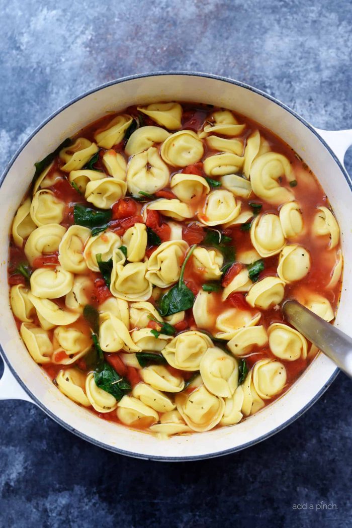 Vegetable Tortellini Soup Recipe - This quick and easy vegetable tortellini soup comes together in minutes for a flavorful soup recipe loaded with vegetables and delicious bites of tortellini. // addapinch.com