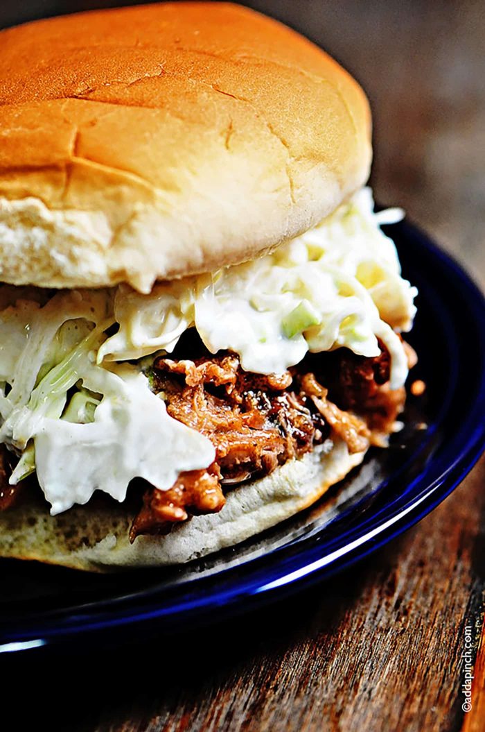Perfect Pulled Pork Recipe - This simple slow cooker recipe makes the most amazing pulled pork! So easy! // addapinch.com